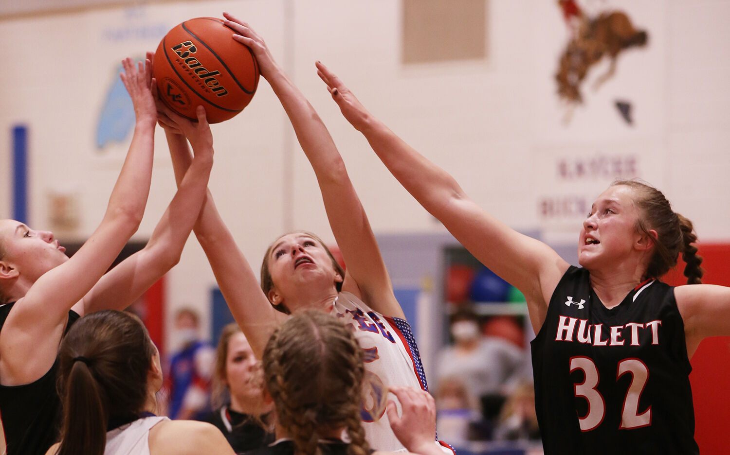 Madison Gosney recovers a rebound after a missed Kaycee shot